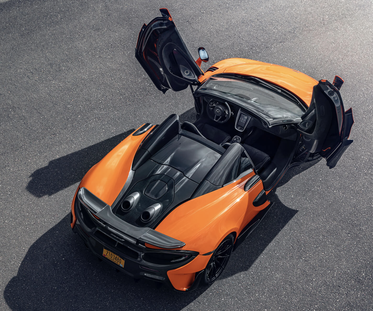McLaren supercar with doors swung open 